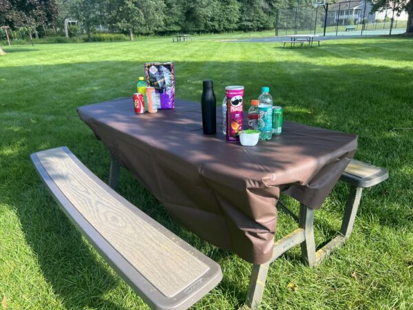 brown tarp covering picnic table