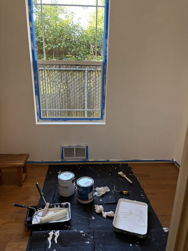 drop cloth covering floor with paint cans